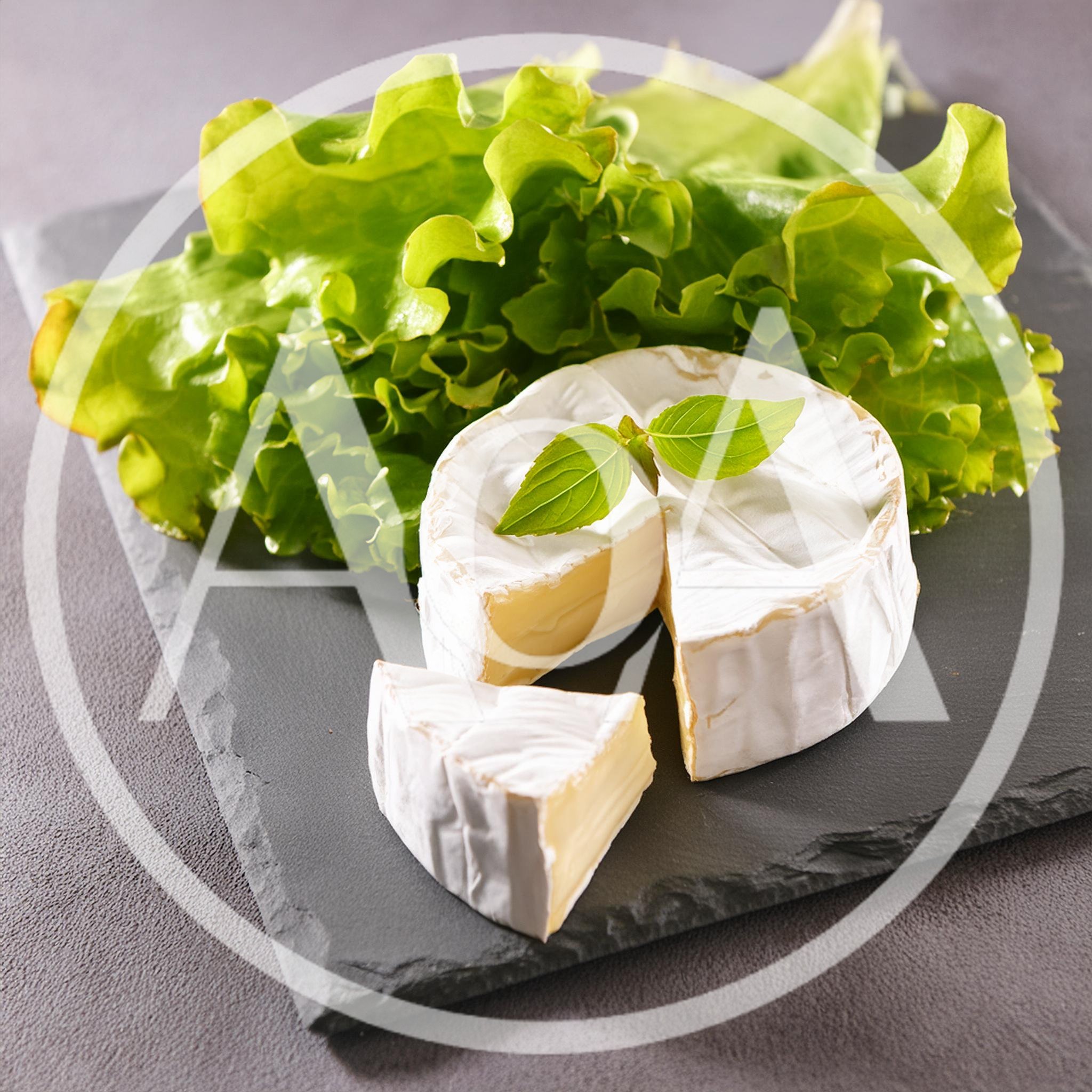 Camembert Cheese Wheel With Lettuce On Slate Board