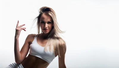 Fit Blonde Woman Posing In White Sportswear