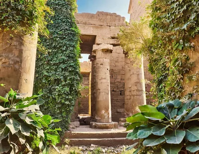 Ancient Egyptian Temple Ruins With Lush Green Vegetation