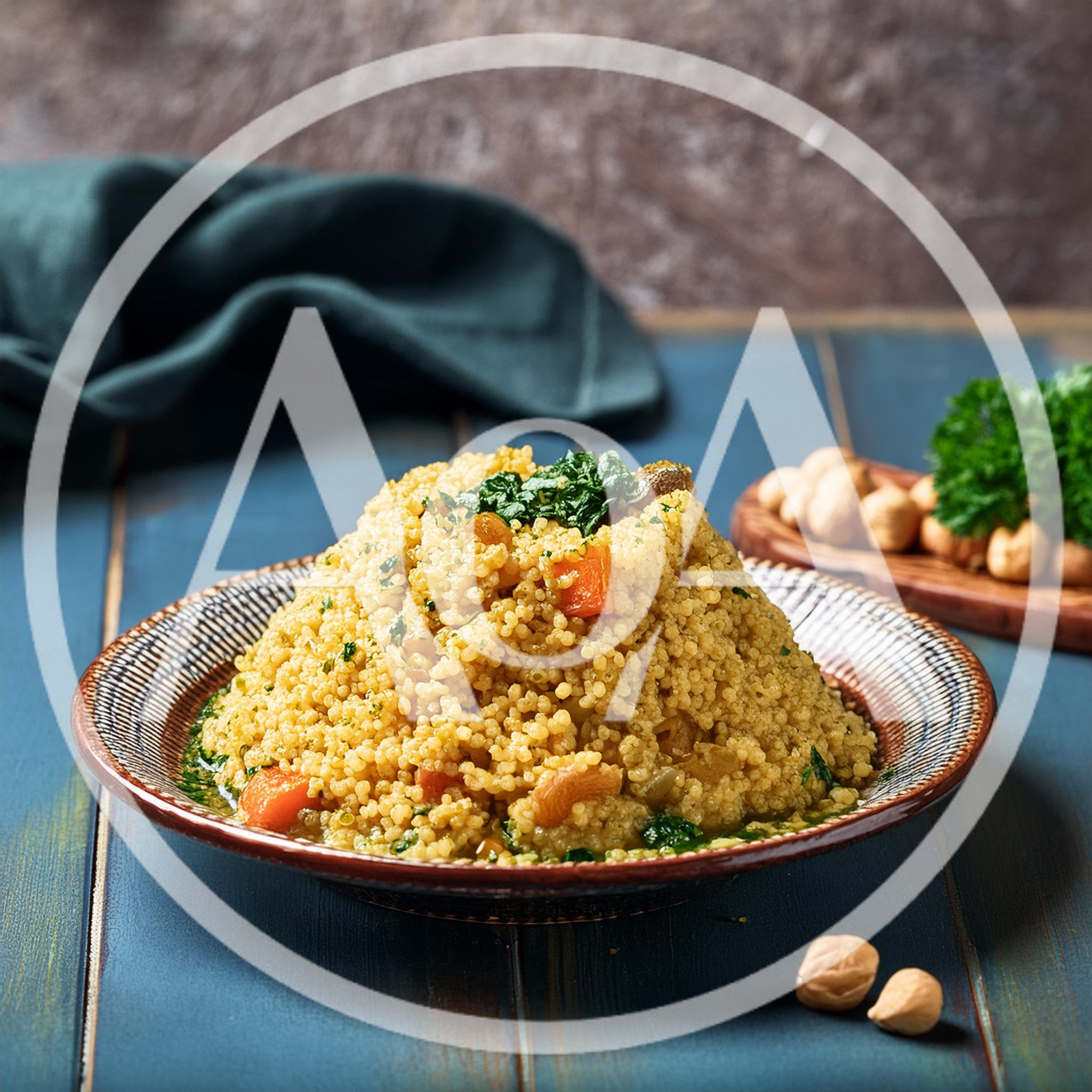 Couscous Salad With Vegetables And Nuts On A Plate