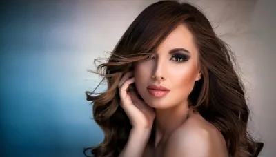 Portrait Of A Beautiful Woman With Wavy Brown Hair