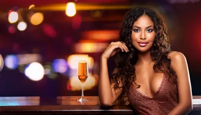 Beautiful Woman With Champagne Glass At A Nightclub