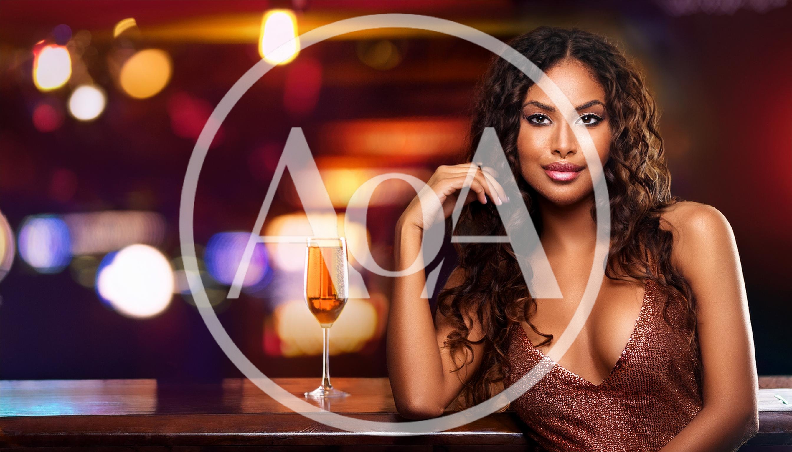 Beautiful Woman With Champagne Glass At A Nightclub