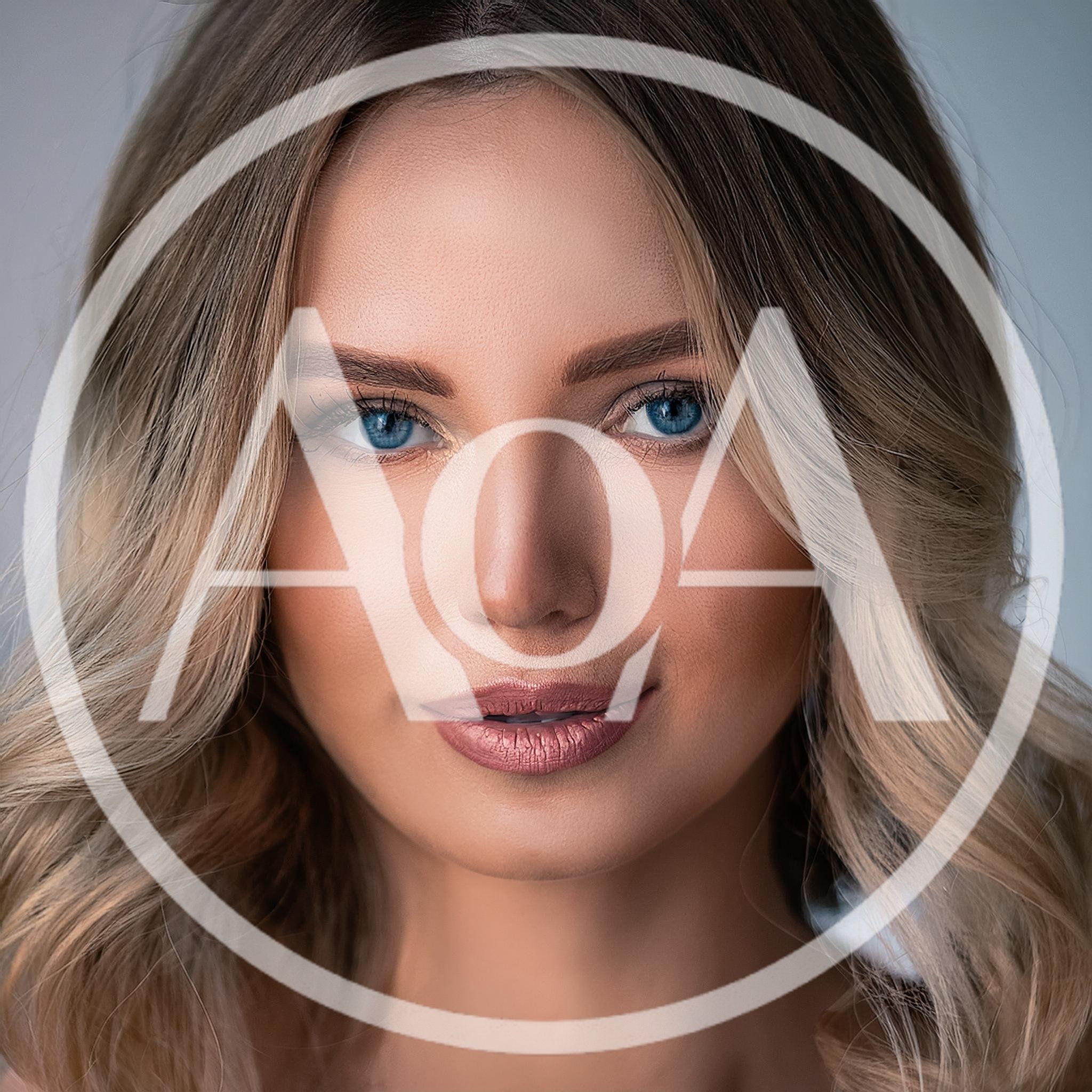 Portrait Of A Beautiful Blonde Woman With Blue Eyes