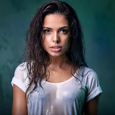 Portrait Of A Wet Woman In A White T-Shirt