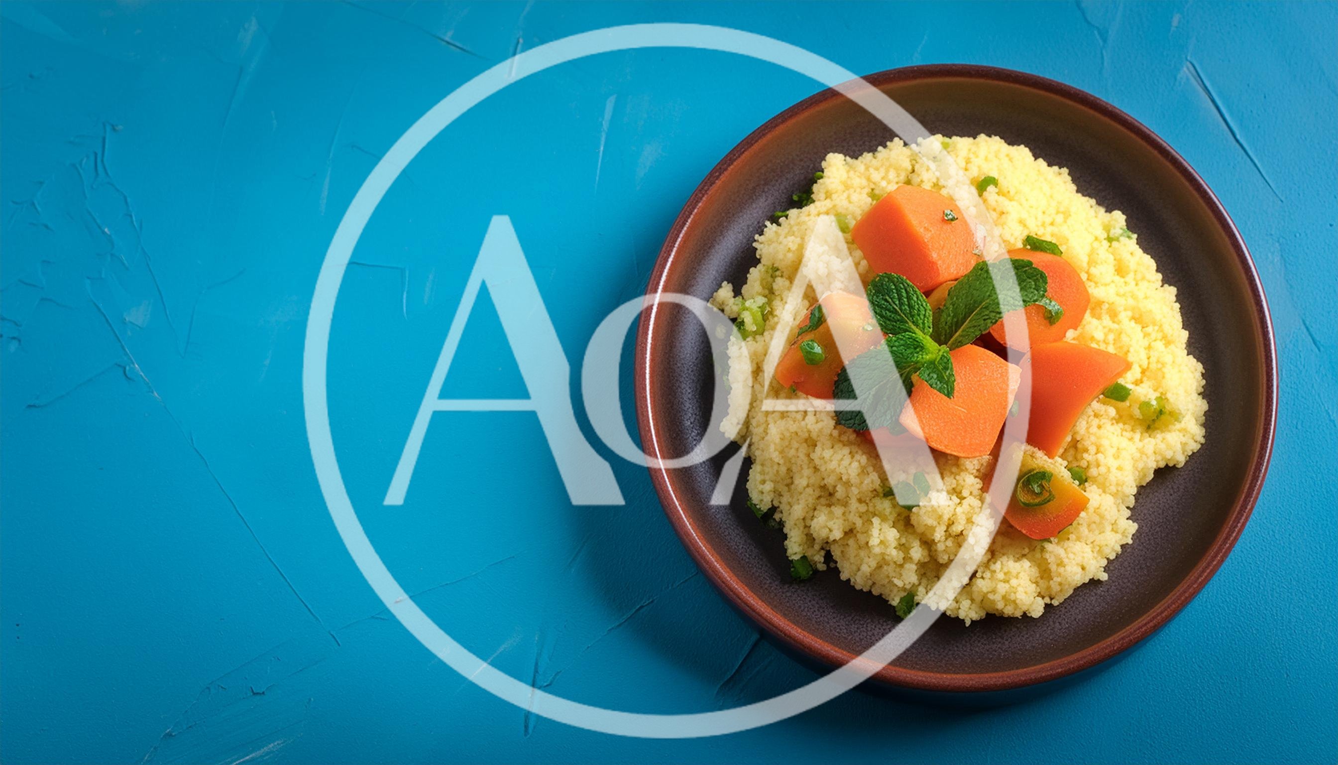 Couscous Salad With Carrots And Mint On Blue Background