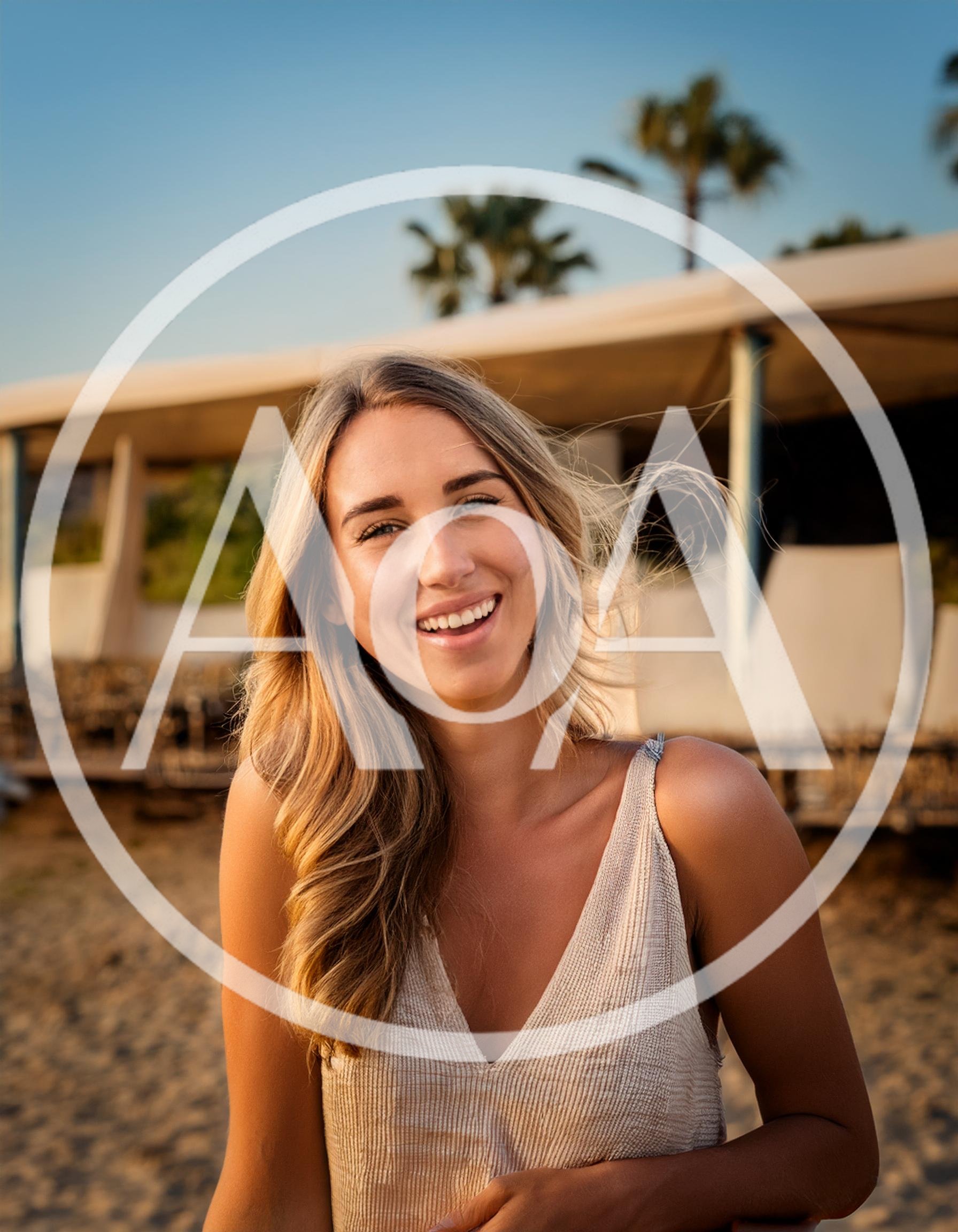 Smiling Young Woman Standing On A Sunny Beach