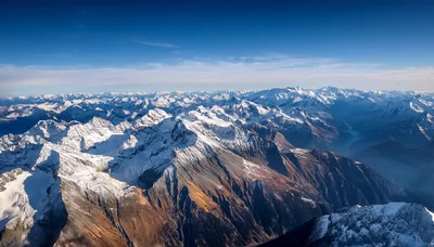 Aerial View Of Snow Covered Alpine Mountain Range