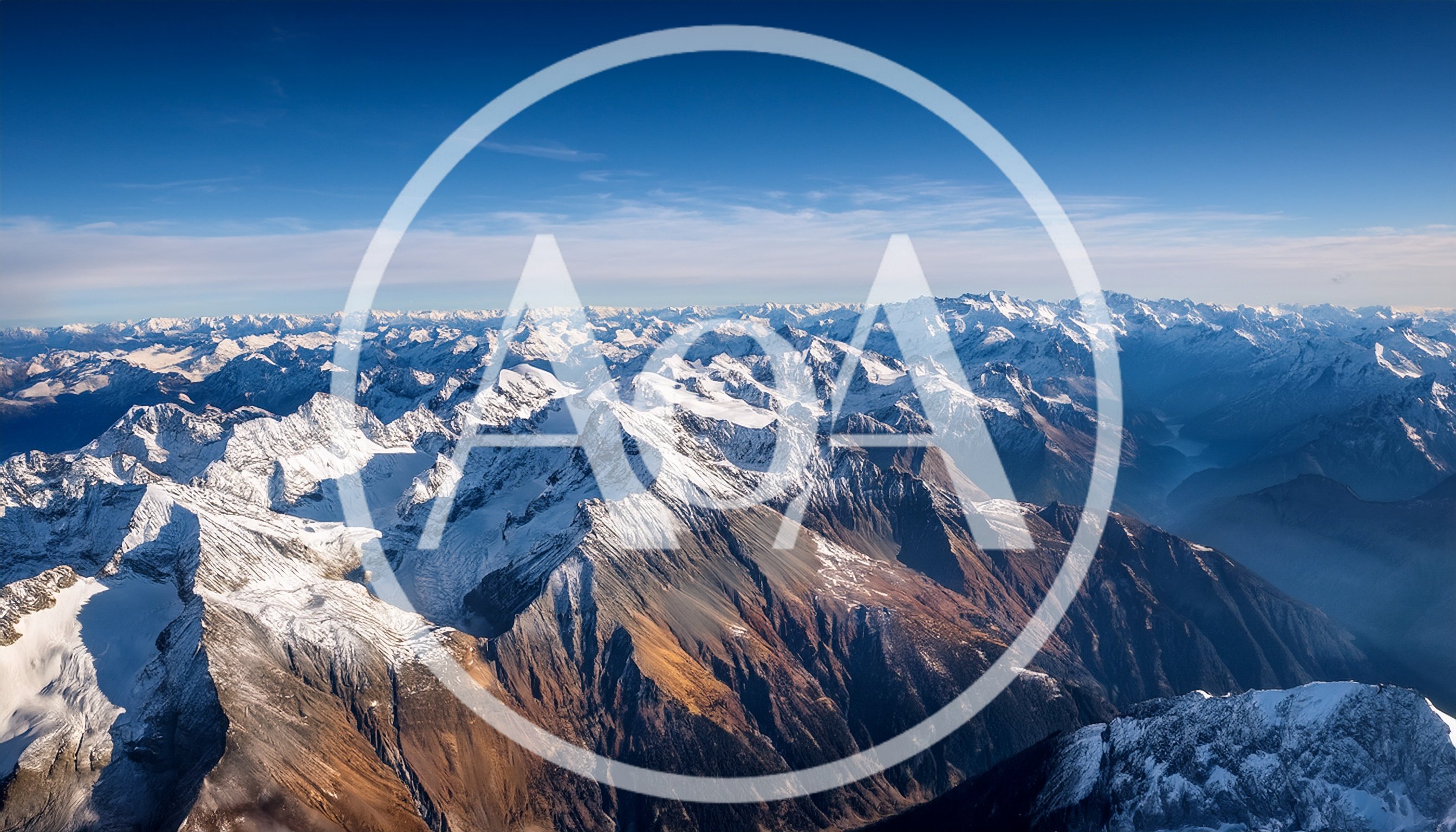 Aerial View Of Snow Covered Alpine Mountain Range