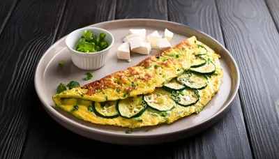 Zucchini Omelet With Feta Cheese On A Plate