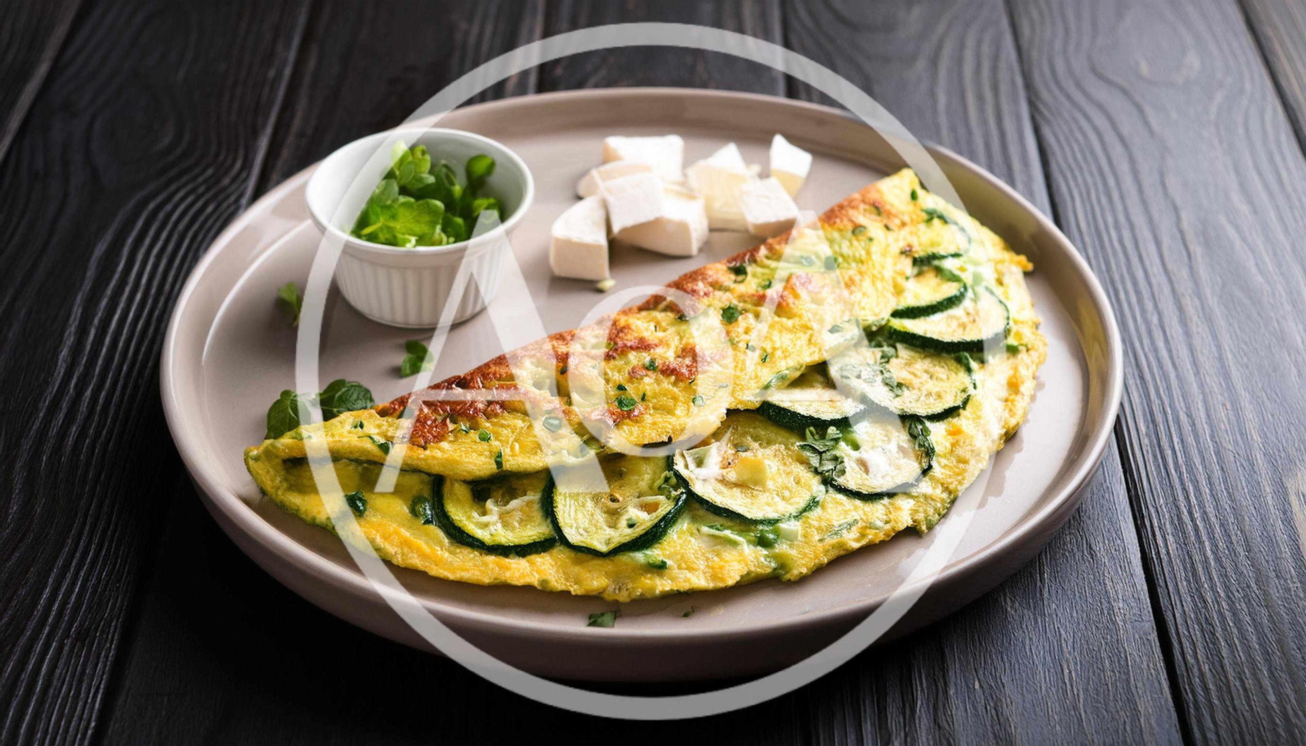 Zucchini Omelet With Feta Cheese On A Plate