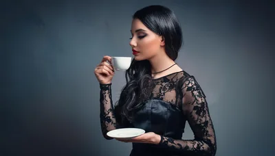 Elegant Woman Drinking Tea In A Black Lace Dress
