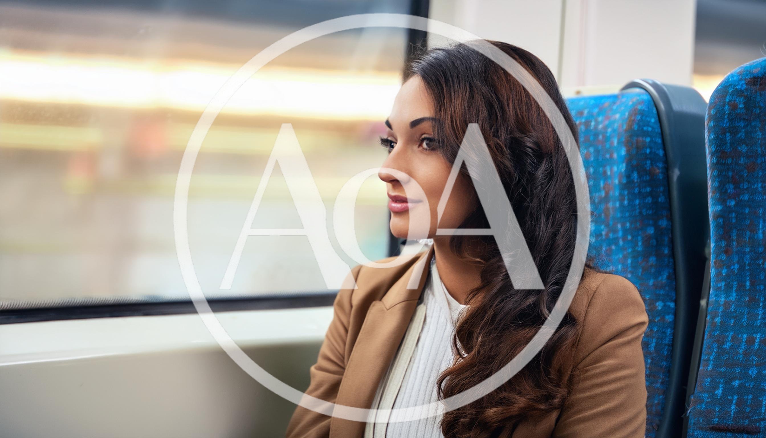 Young Woman Looking Out Train Window During Commute