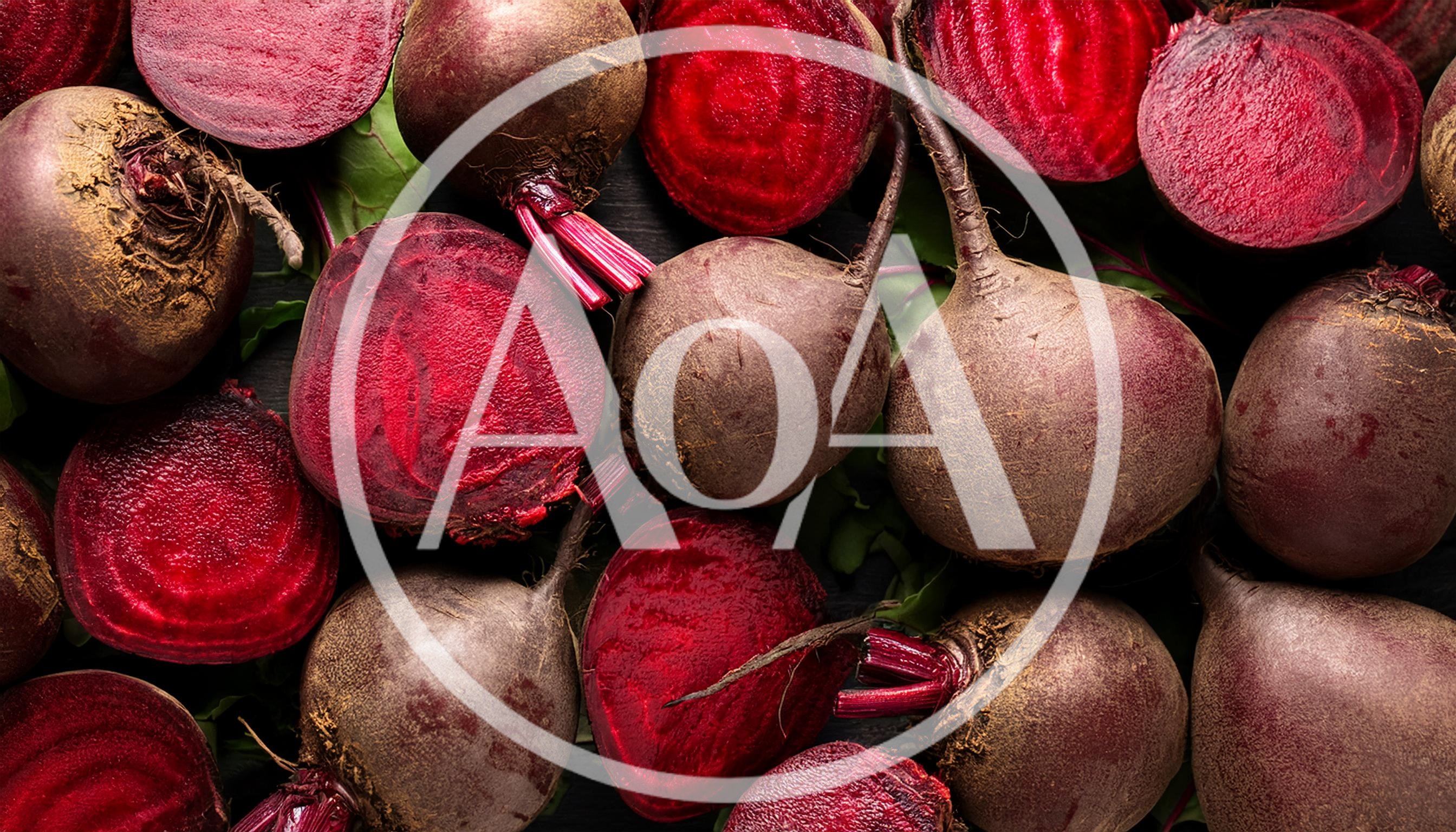 Fresh Raw Beetroots With Green Leaves On Dark Background