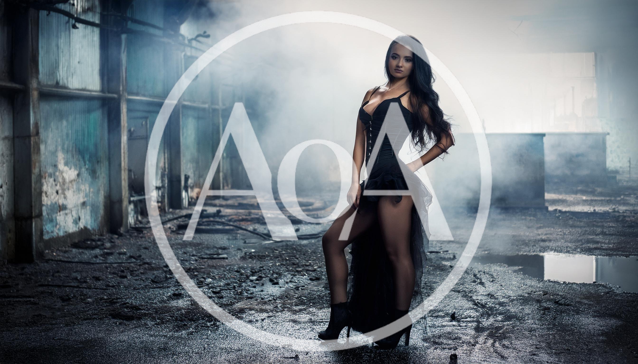 Fashion Model Posing In A Dark Industrial Warehouse