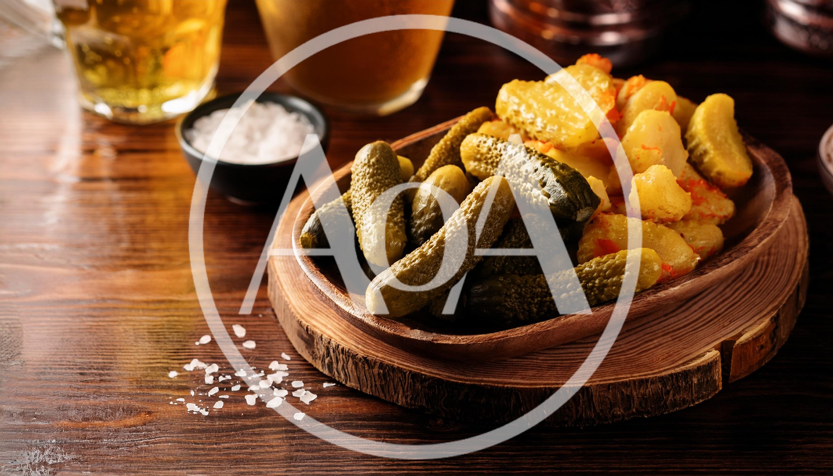 Pickles and Roasted Potatoes on a Wooden Platter