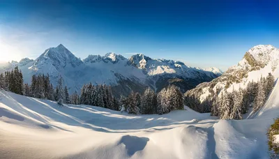 Panoramic View Of Snowy Alpine Mountains In Winter