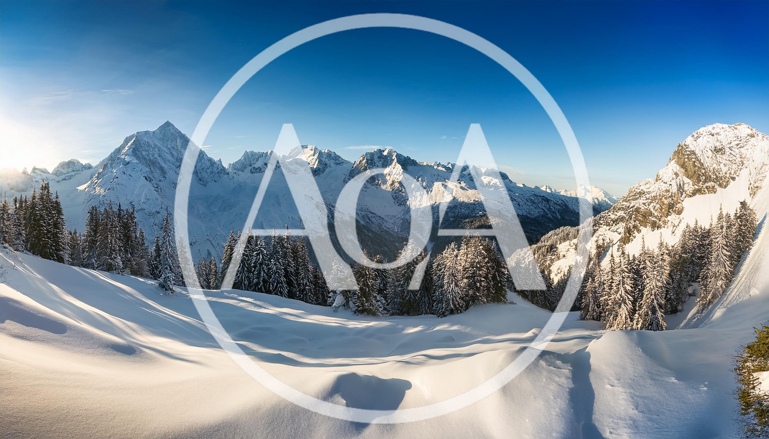 Panoramic View Of Snowy Alpine Mountains In Winter