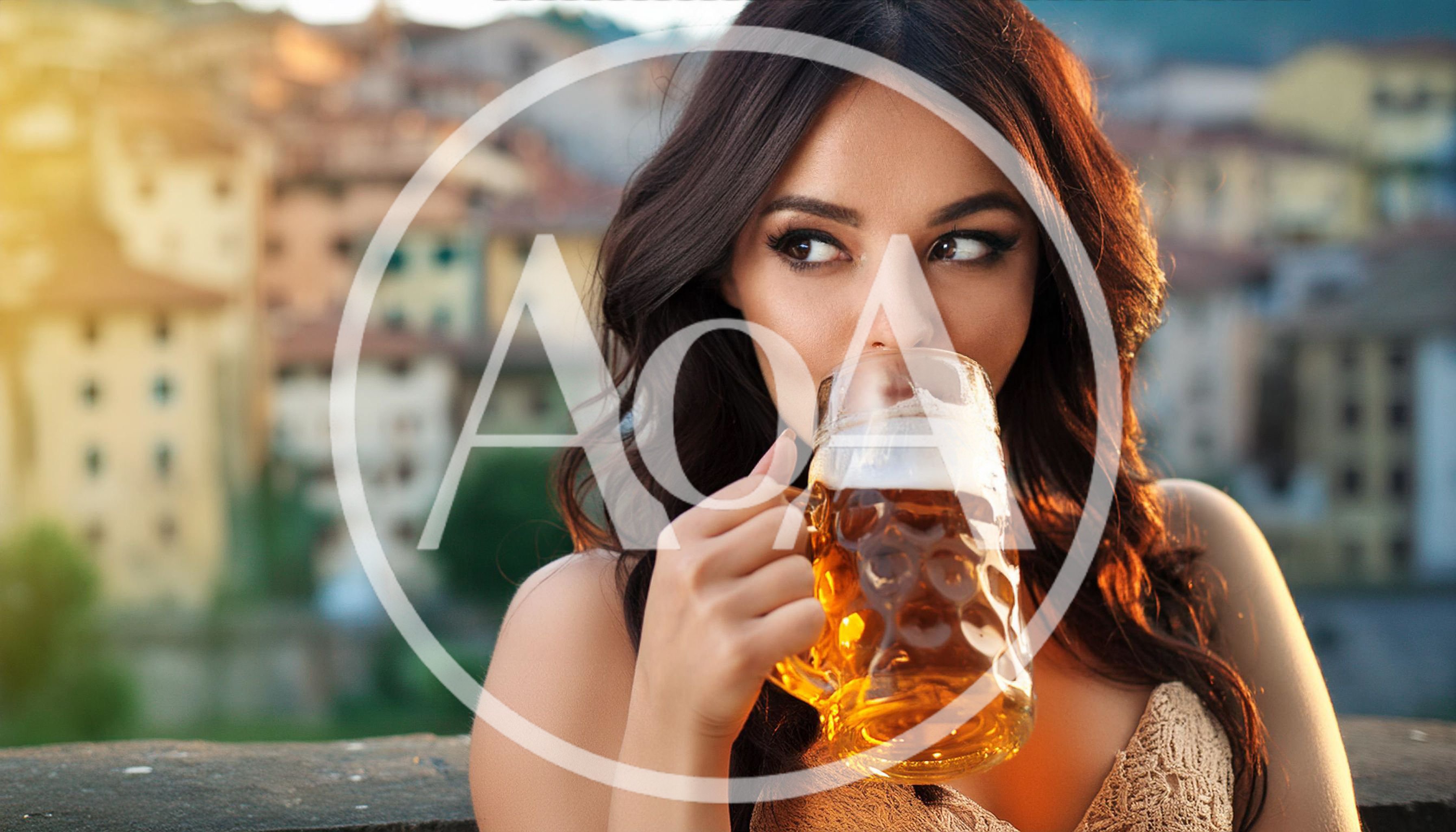 Young Woman Drinking Beer From A Glass Mug