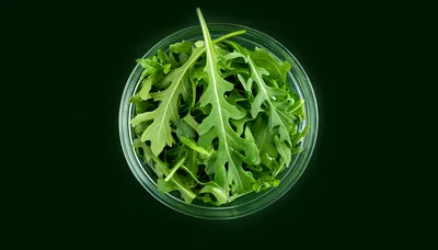 Fresh Arugula Leaves In A Glass Bowl