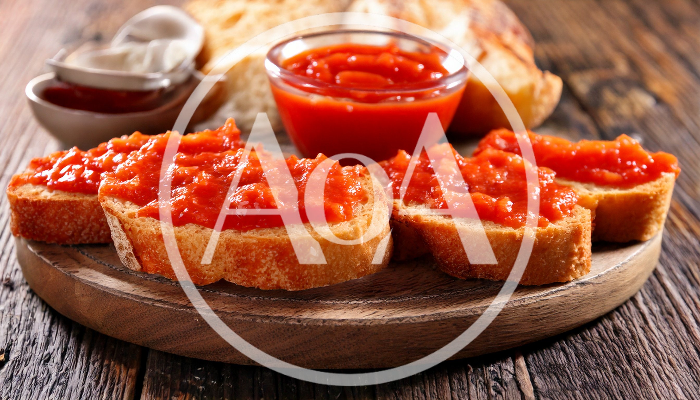 Toasted Bread Slices With Tomato Spread On Wooden Board