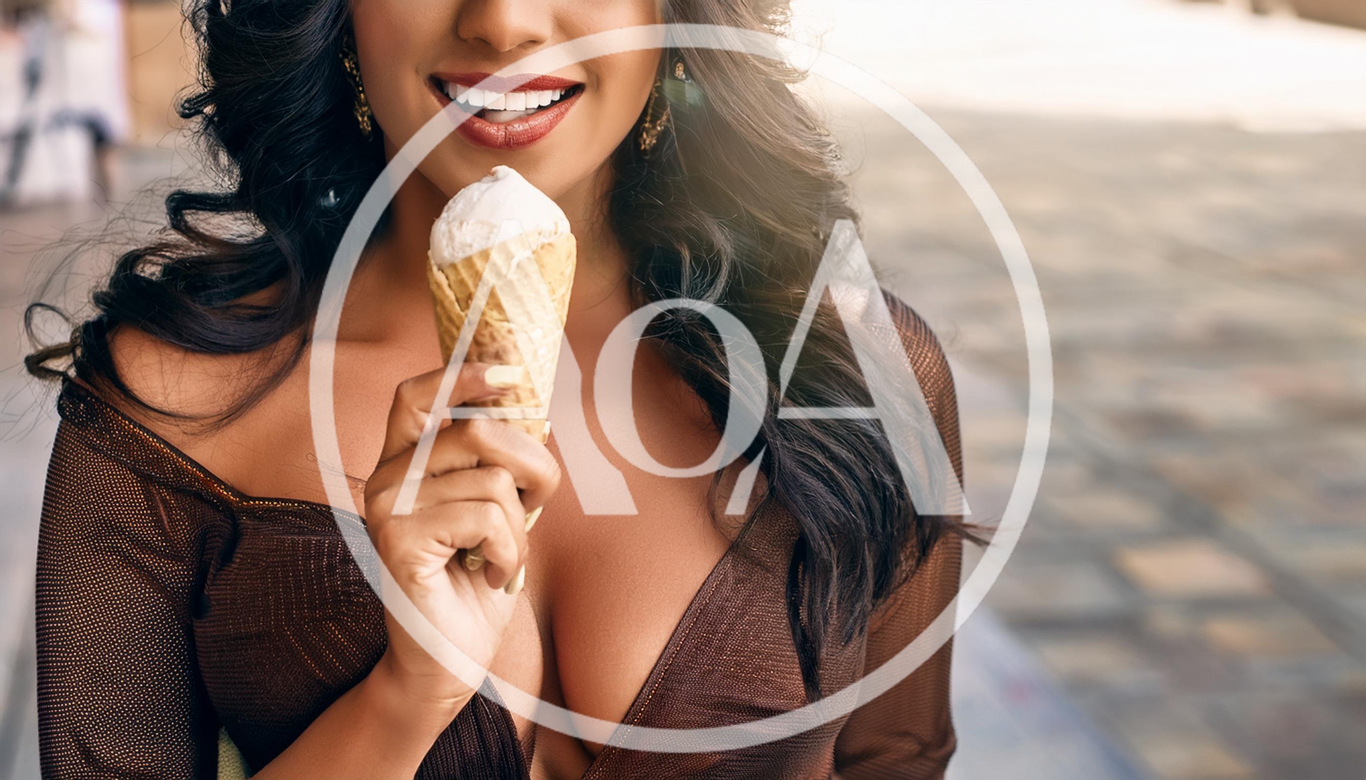 Woman Holding Ice Cream Cone Outdoors