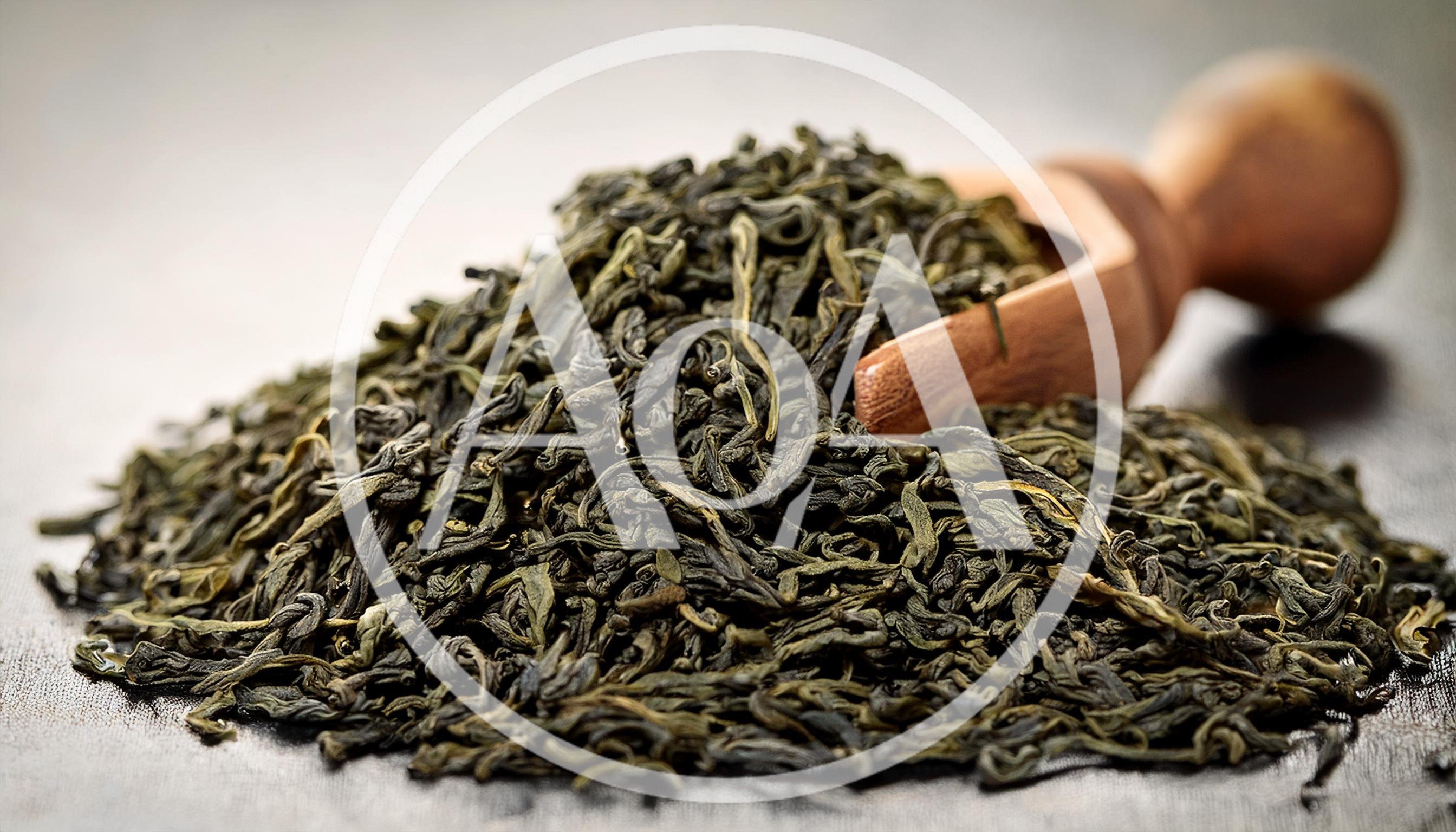 Dried Green Tea Leaves With Wooden Scoop