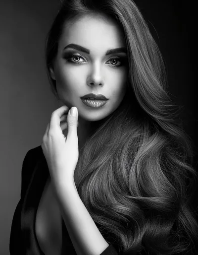 Portrait Of A Beautiful Woman With Long Wavy Hair
