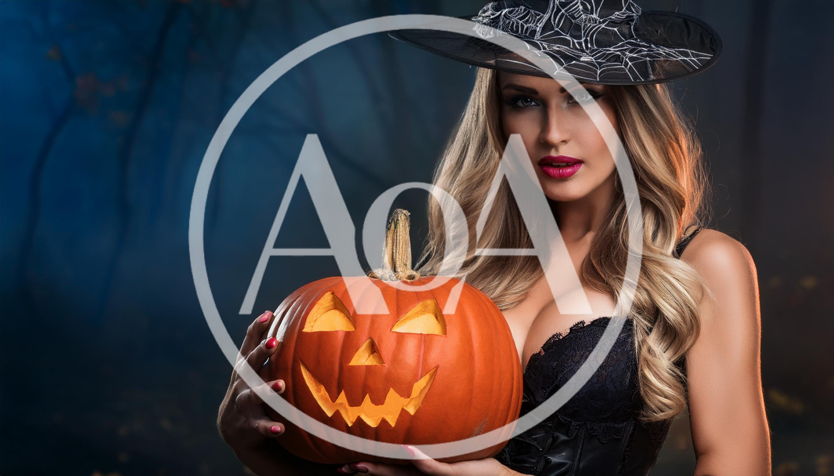 Beautiful Woman Dressed As A Witch Holding A Pumpkin