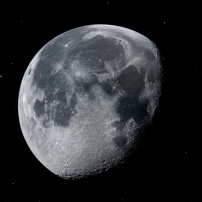 Detailed Gibbous Moon Surface Against Deep Space Background