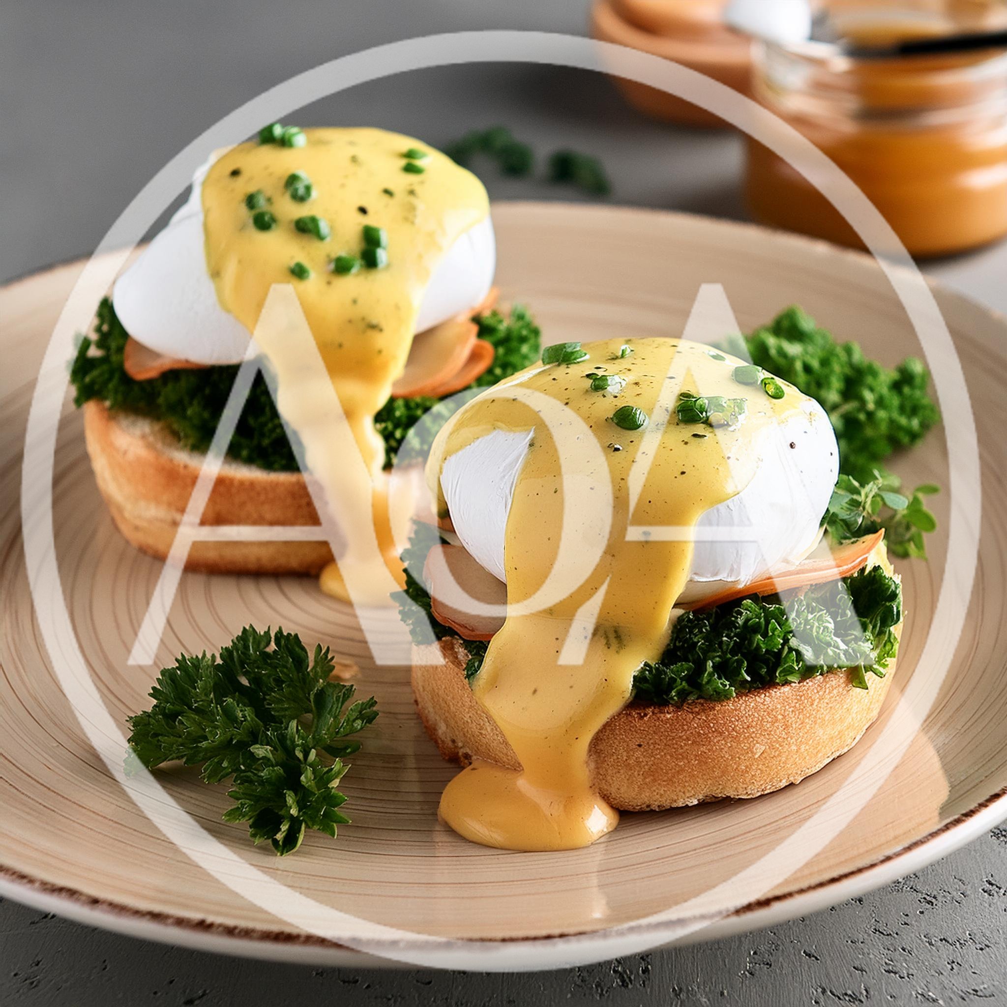 Two Eggs Benedict With Hollandaise Sauce On A Plate