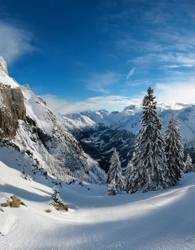 Snowy Mountain Landscape With Groomed Ski Slope