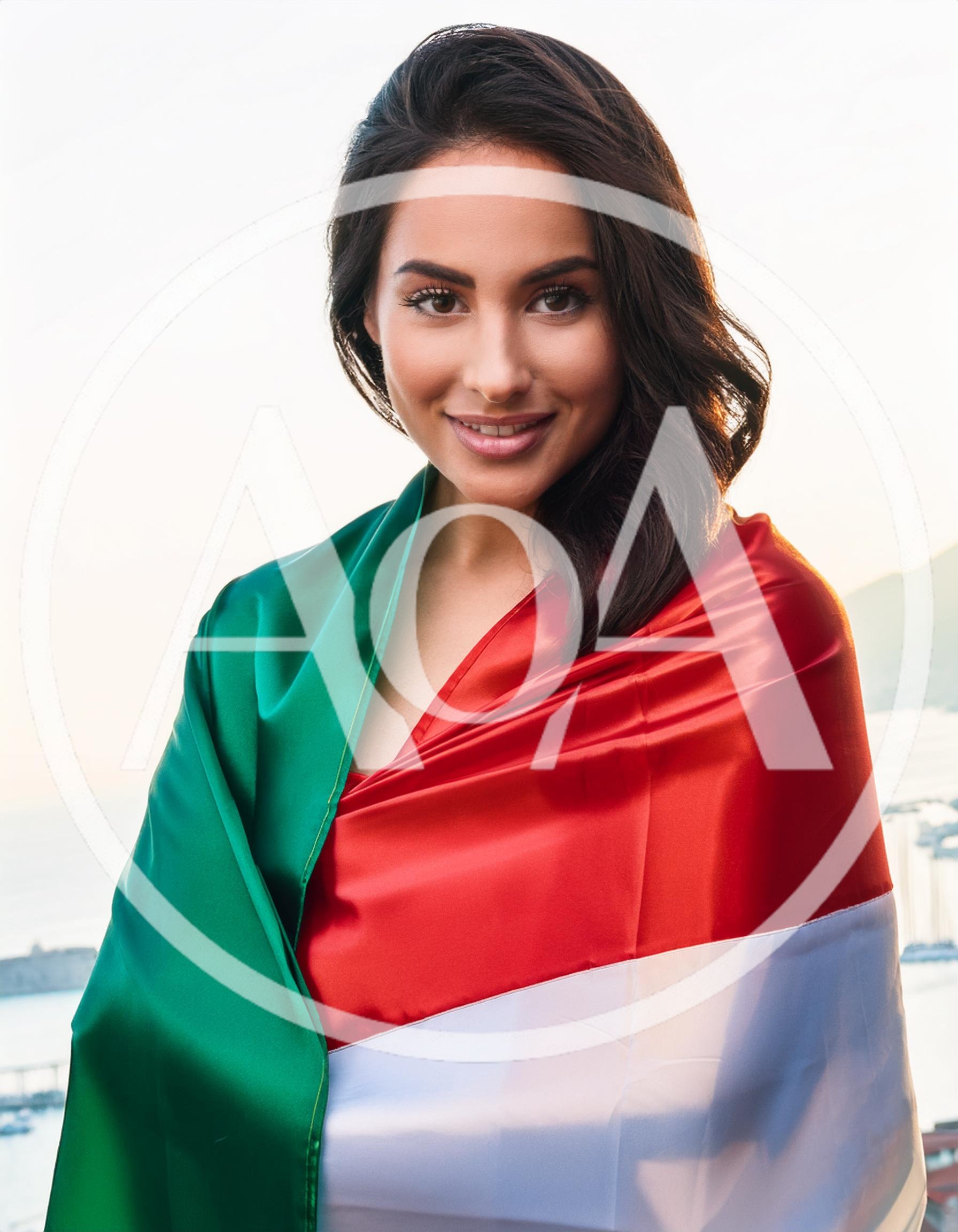 Young Woman Wrapped In Italian Flag Outdoors