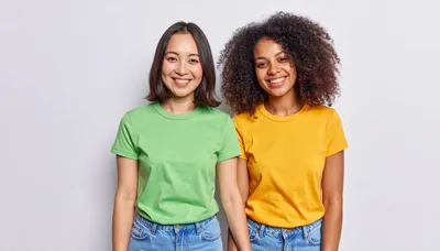 Two Diverse Young Women Smiling Together