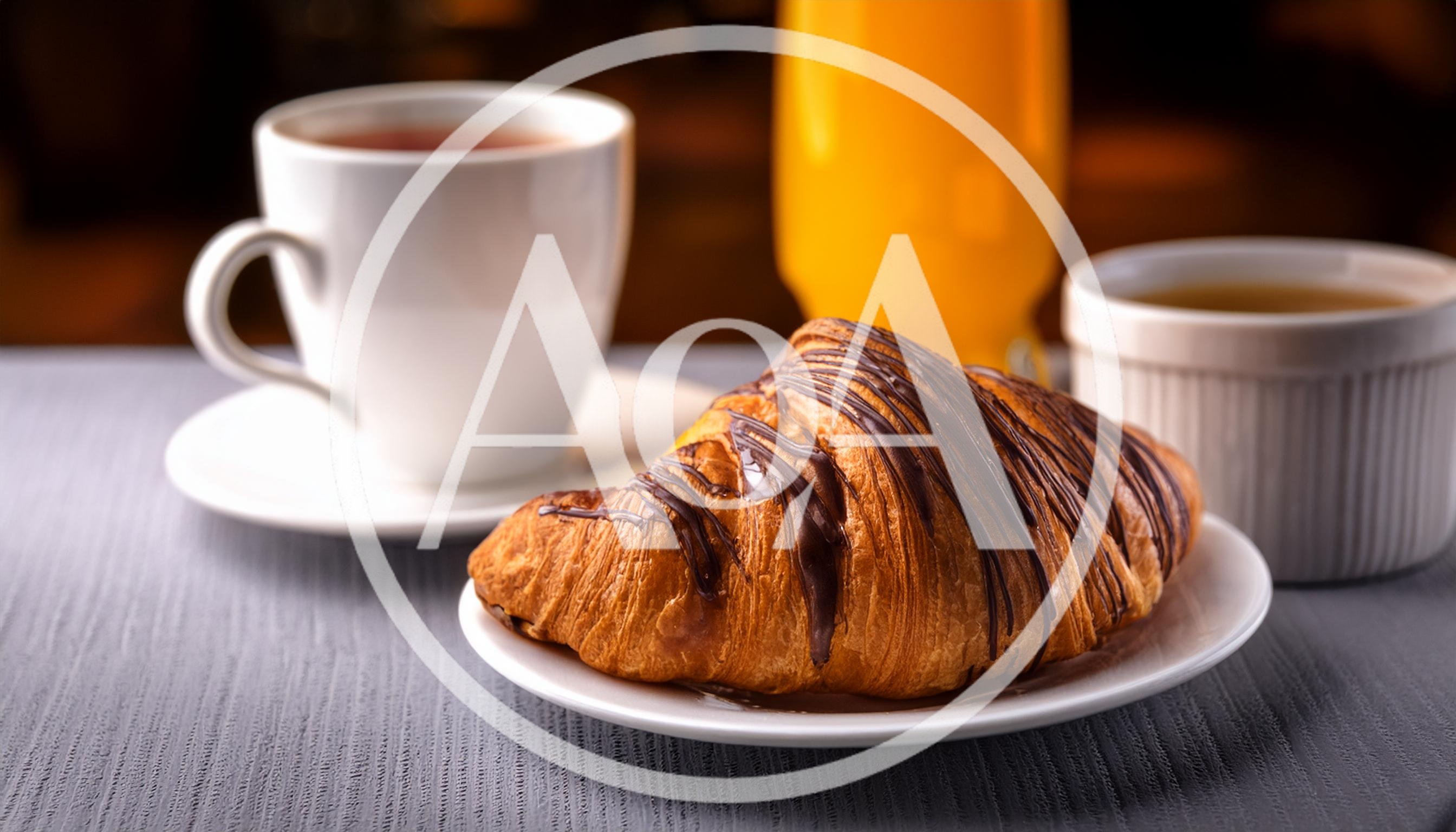 Chocolate Drizzled Croissant With Coffee And Orange Juice