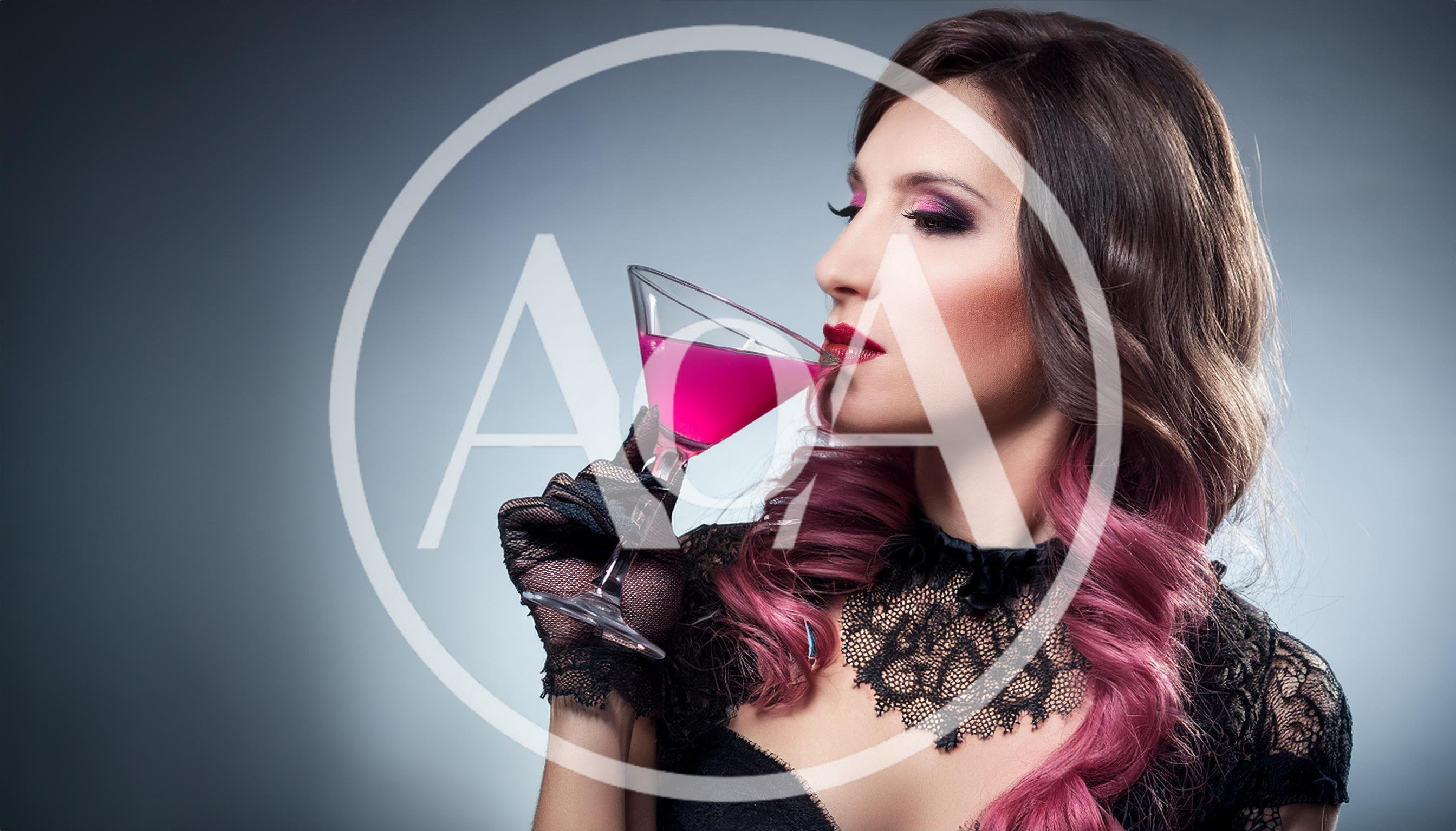 Elegant Woman Drinking Pink Cocktail in Lace Gloves