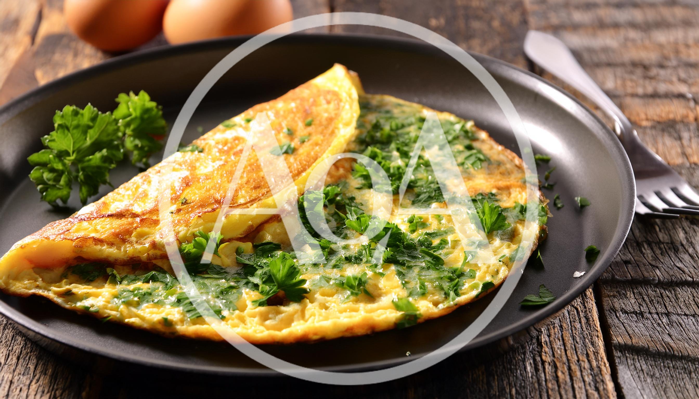Fresh Herb Omelet Served On A Black Plate