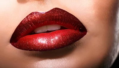 Close Up Of Woman Wearing Red Glitter Lipstick