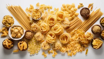 Assorted Dry Pasta Varieties on White Background