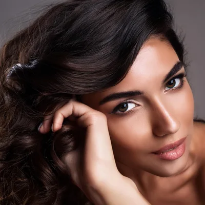Portrait Of A Beautiful Woman With Wavy Hair