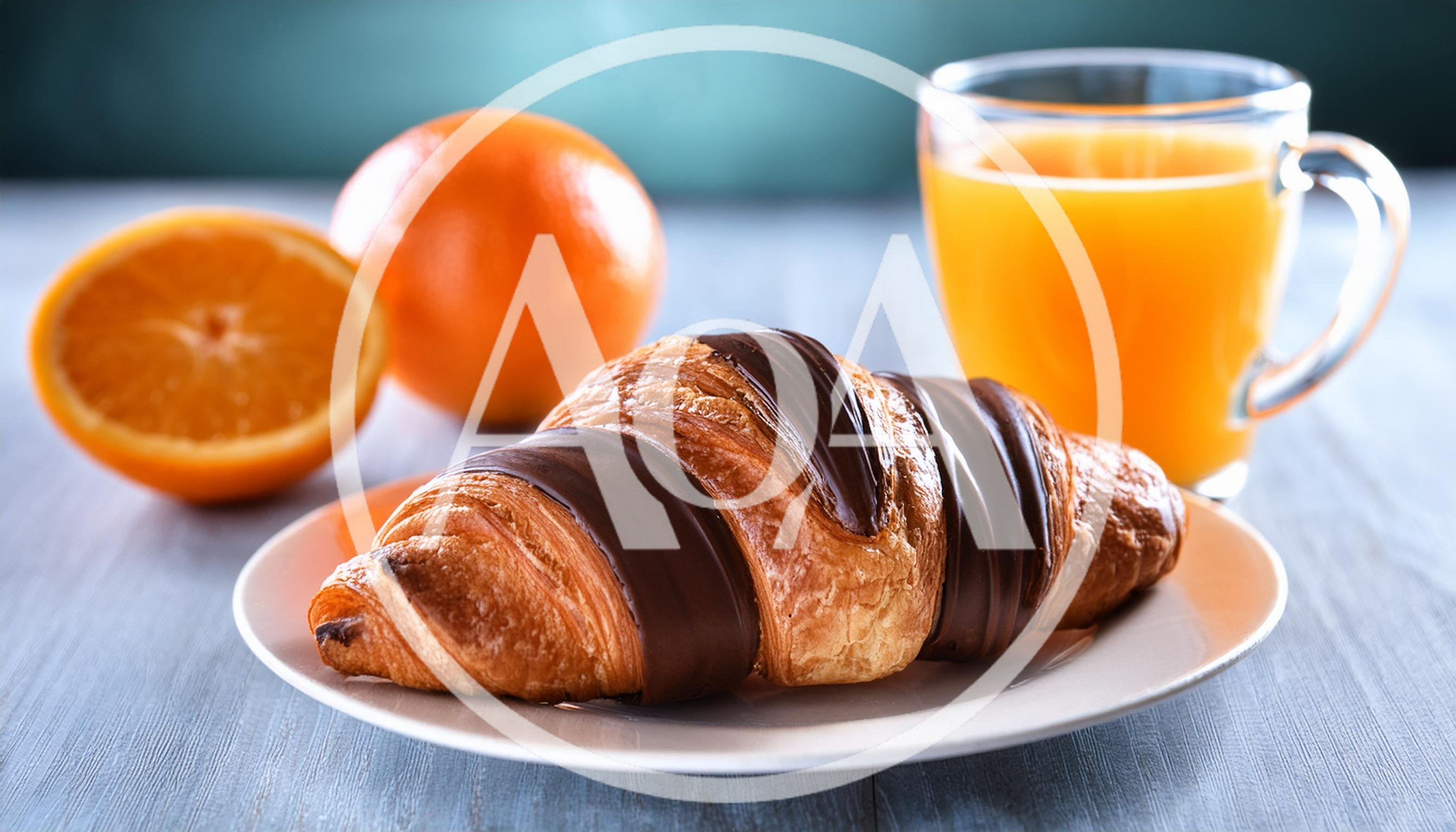 Chocolate Drizzled Croissant With Orange Juice And Oranges