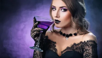Elegant Woman Holding A Purple Martini Glass