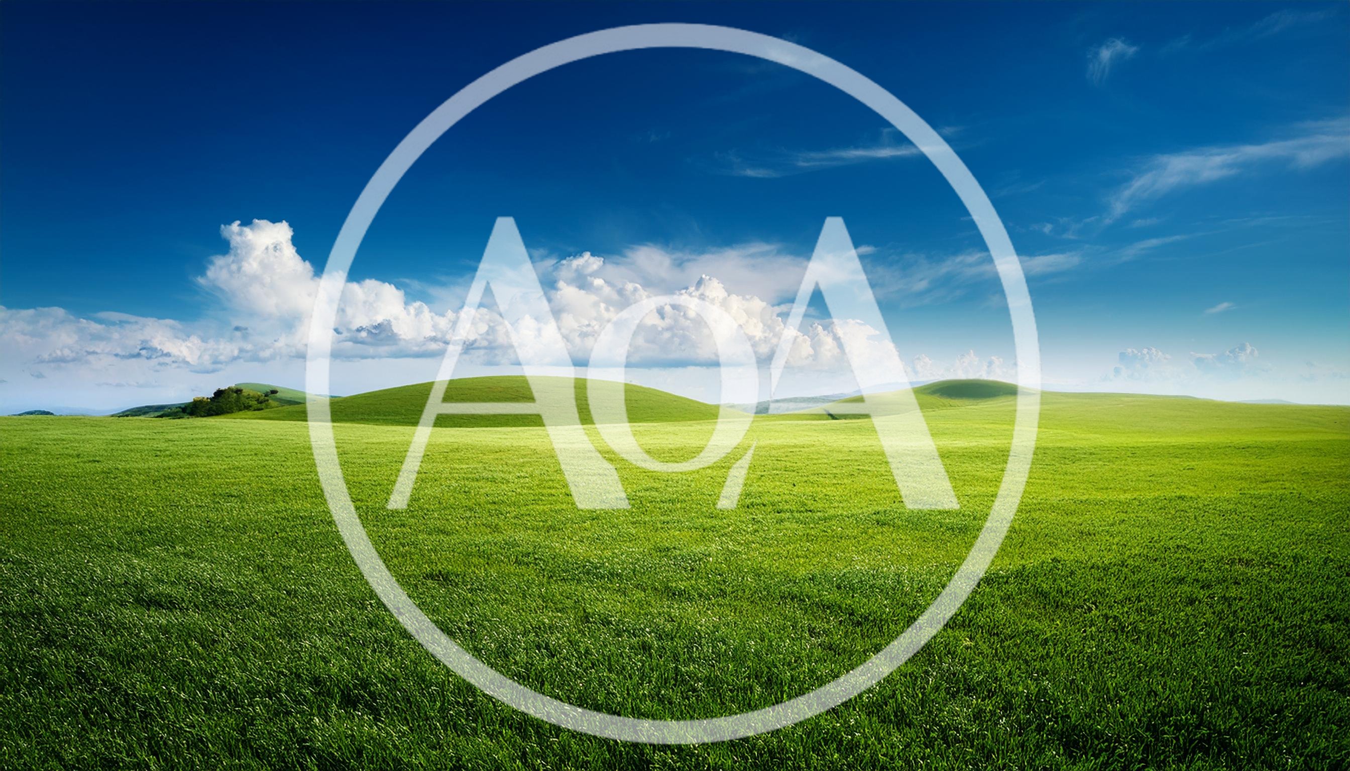 Rolling Green Hills Under A Bright Blue Sky