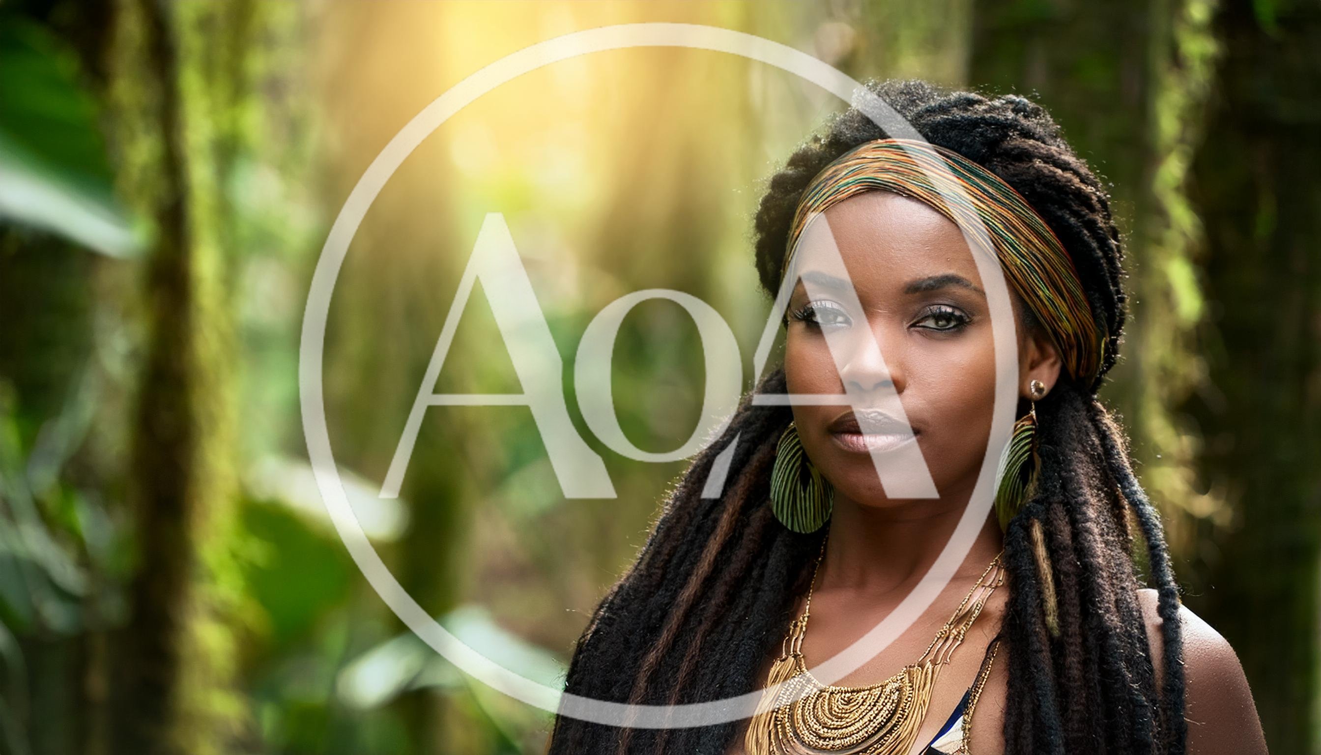 Portrait Of A Beautiful Woman With Dreadlocks In Nature