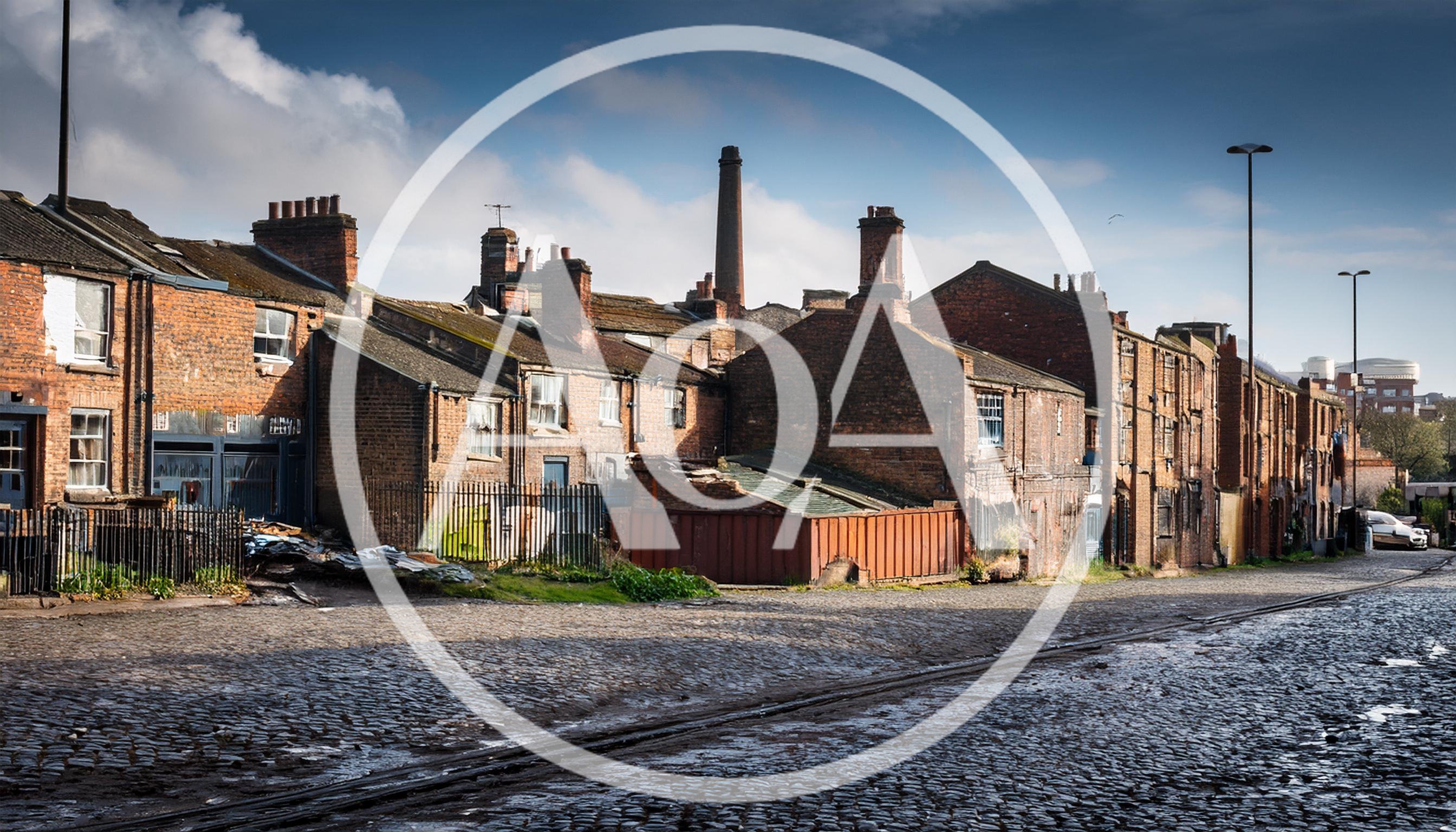 Old Industrial Brick Terraced Houses On Cobblestone Street