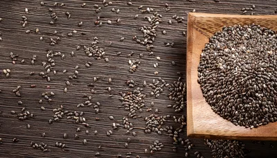 Chia Seeds In A Wooden Bowl On Dark Wood