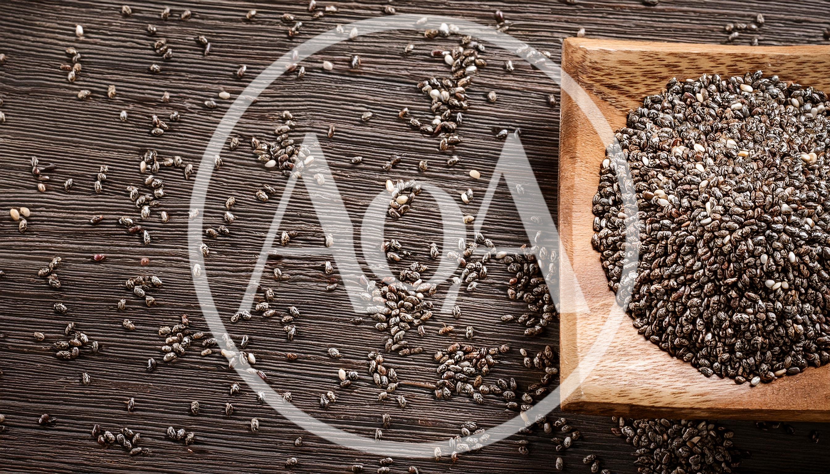 Chia Seeds In A Wooden Bowl On Dark Wood