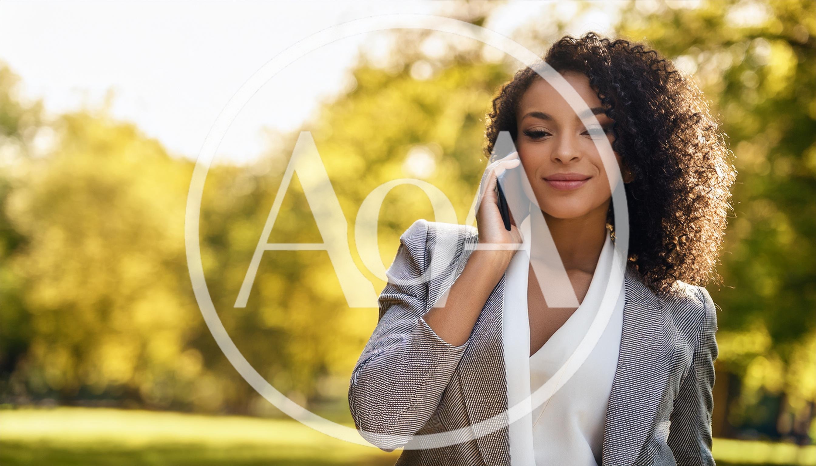Professional Woman Talking on Smartphone in Park