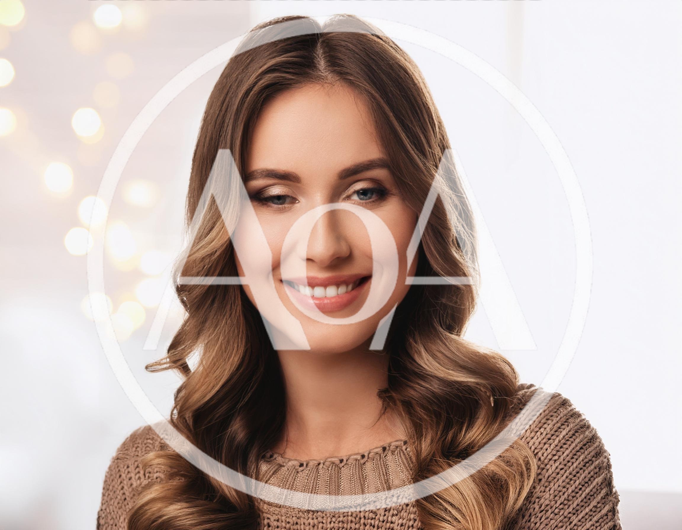 Portrait Of A Smiling Young Woman With Wavy Hair