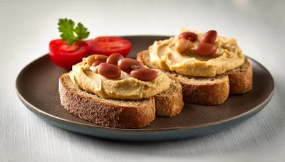Two Slices Of Hummus Toast With Kidney Beans